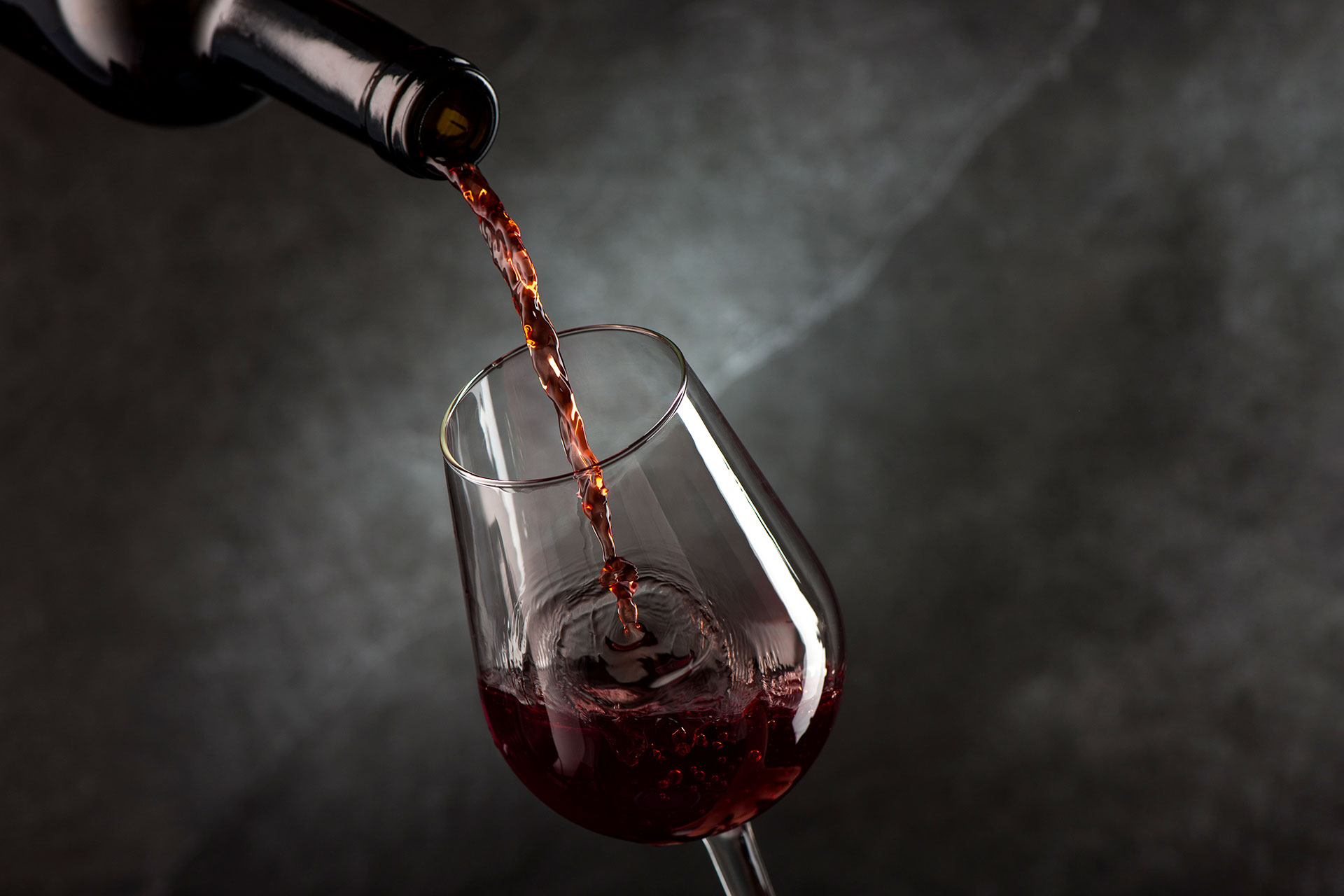 pouring-wine-from-bottle-glass